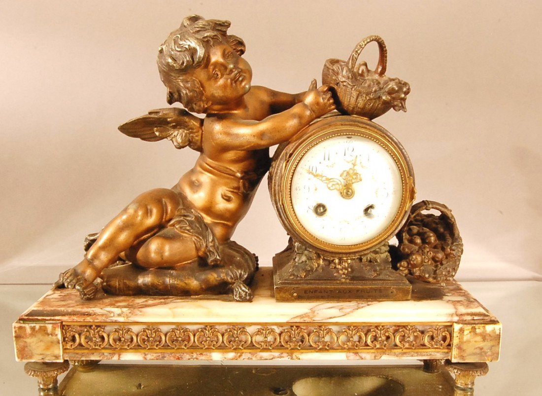 F. Marti French Figural Mantel clock. "Enfant Aux : F. Marti French Figural Mantel clock. "Enfant Aux Fruits" by Louis et Francois Moreau. Bronzed patina, spelter statue on marble base. Works signed F. Marti, Paris Ca. 1900 11" t x 14" w x 5" d