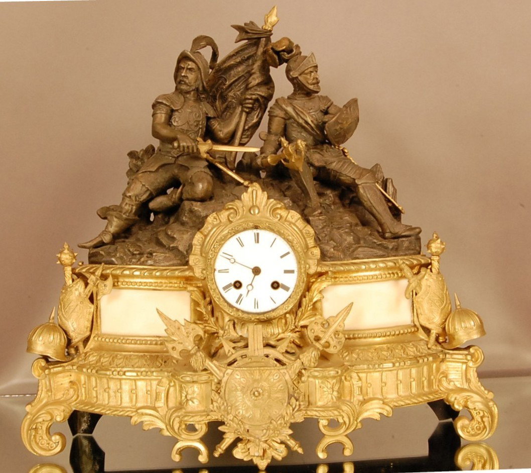 Early French Figural mantel clock with Spelter Col: Early French Figural mantel clock with Spelter Colonial soldiers setting on top of clock, bronze & marble base with shields of armoire. Porcelain Dial, Time & Strike. Early Silk String movement. Works