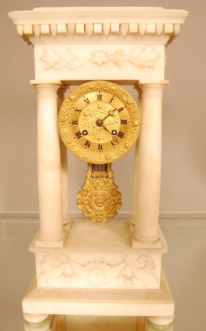 French Empire Period Dore Bronze & Marble shelf c: French Empire Period Dore Bronze & Marble shelf clock with Bronze Dial & Pendulum. 4 marble columns on carved base. 9" w x 5 1/2" d x 17" t Ca. 1870