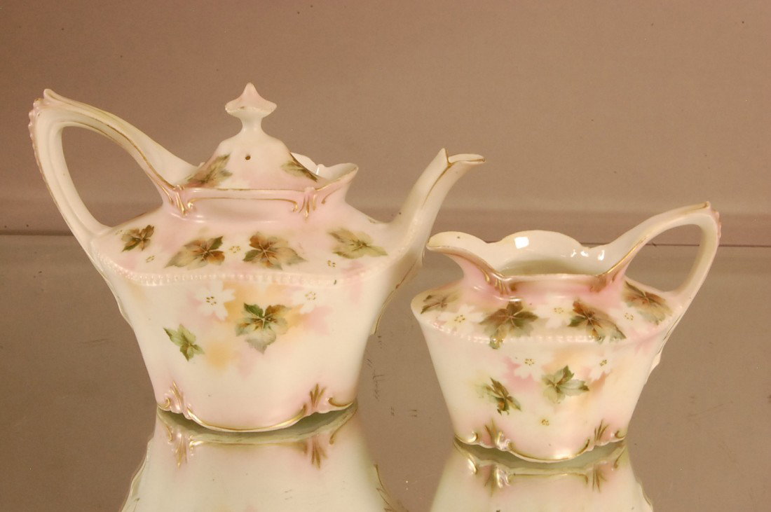R.S. Prussian Tea Pot & Creamer: Teapot 6" t x 8" l x 6" d; Creamer 4" t x 5" l x 4" d red mark RS Prussia 1890