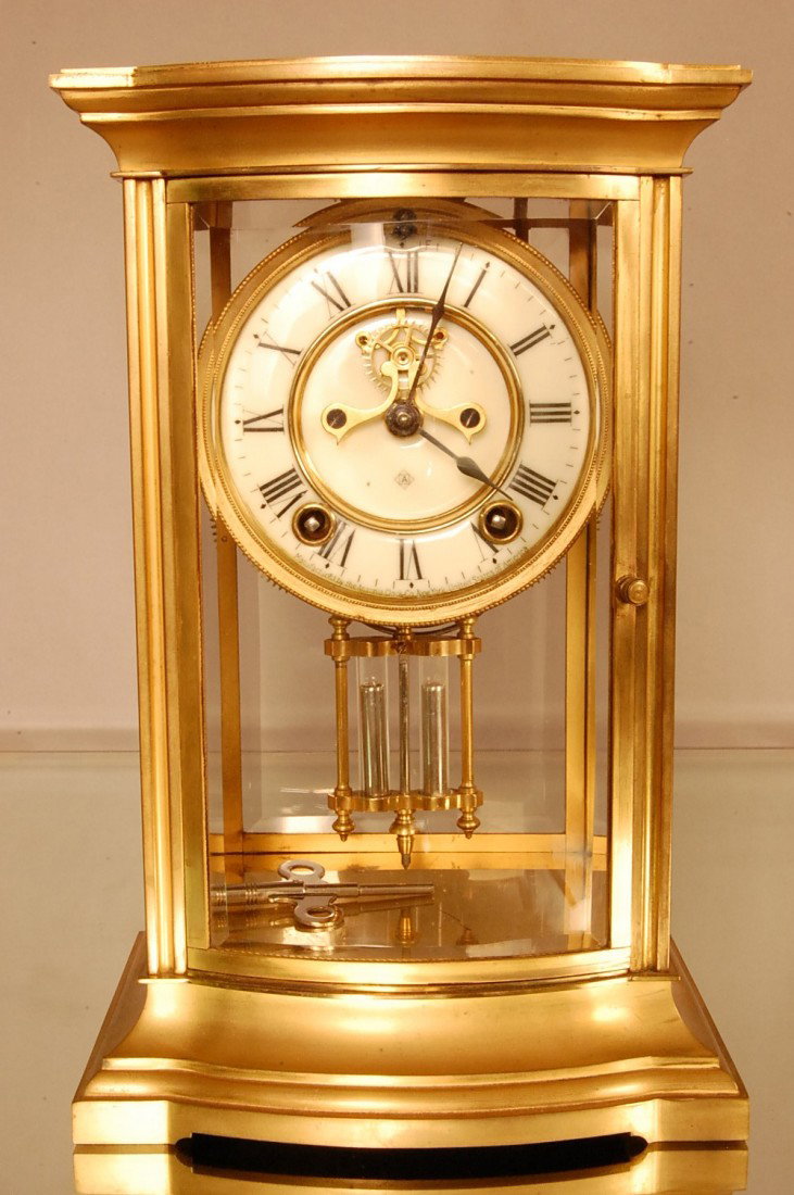 Ansonia Crystal Regulator Clock: Roy model. Curvel Beveled glass in front. Porcelain dial, open escapement. Signed on works Ansonia Clock Co. 11" t x 7 1/2" w x 6" d Ca. 1880