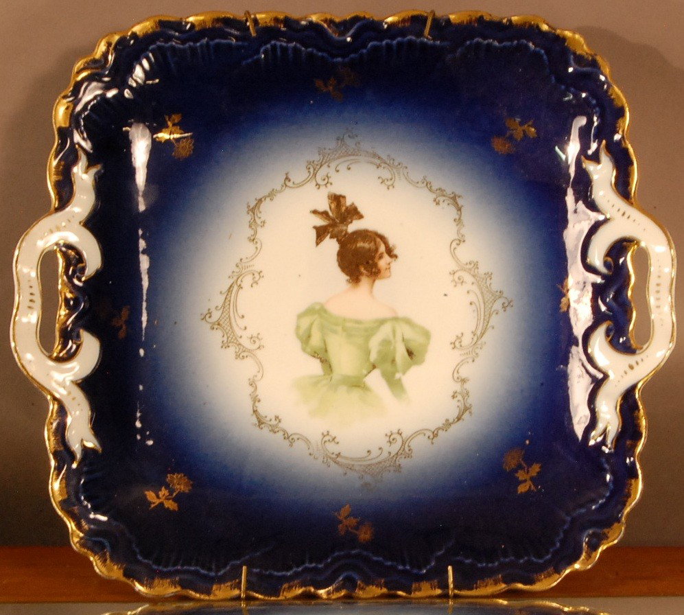 Top Knot Girl in Green Dress.: Blue Portrait tray, 2 handles, hand decorated. P M Bavarian. Ca. 1900