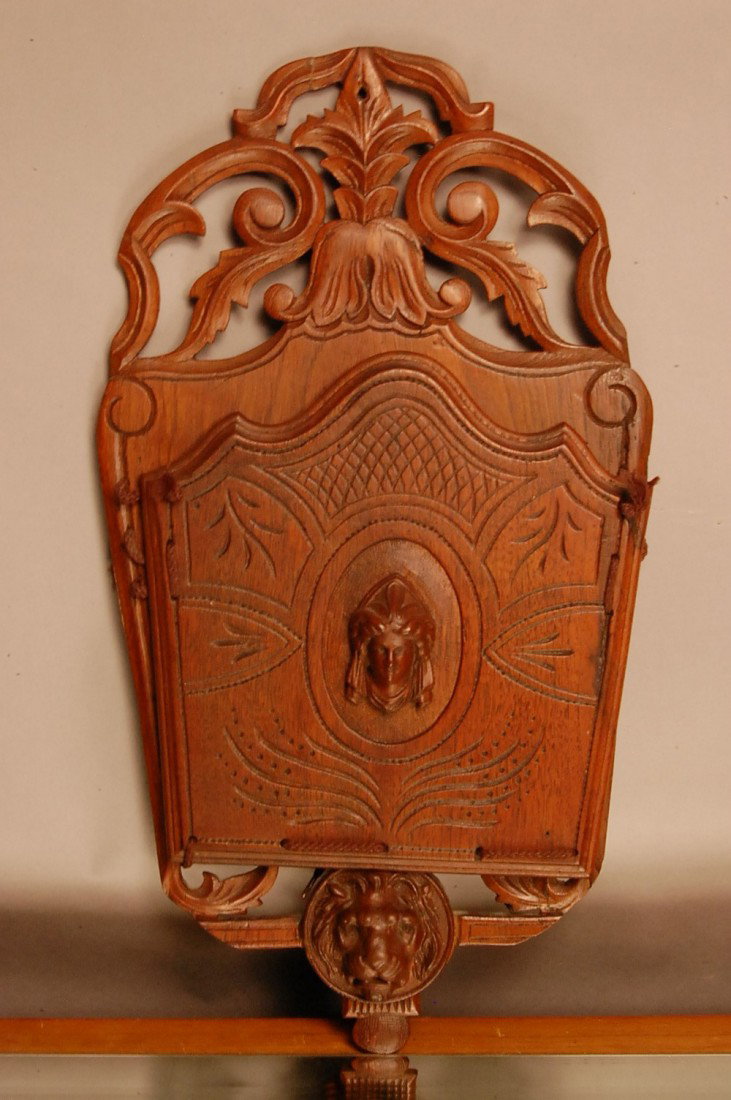 Victorian Walnut Magazine Holder: Open cased top & bottom, Drop Front with carved Jenny Lind Bust on panel. & Lion head carved on bottom. 17" t x 11" w. Ca. 1875