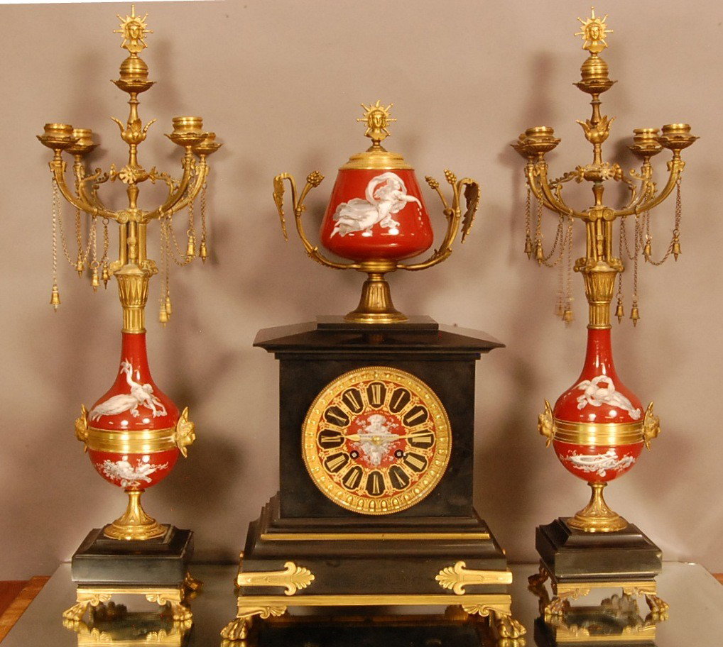 French Louis XIV 3 Pc. Dore Bronze & Porcelain Clo: Decorated Porcelain urn on top , enameled decorated dial. Signed Medalle DeOr 1867. G. Servant, Broncier Parris, Time & Strike. Works Signed L. Marti, Matching numbers on clock & Pendulum. Clock 21" x