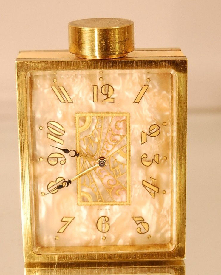 Art Deco Swiss Bronze & Marble Clock: Clock "Le Numero 7 de Juvenia" in the shape of a perfume bottle. Metal work by Didisheim Gold schmid fil & Cie Swiss Signed DG Ca. 1920