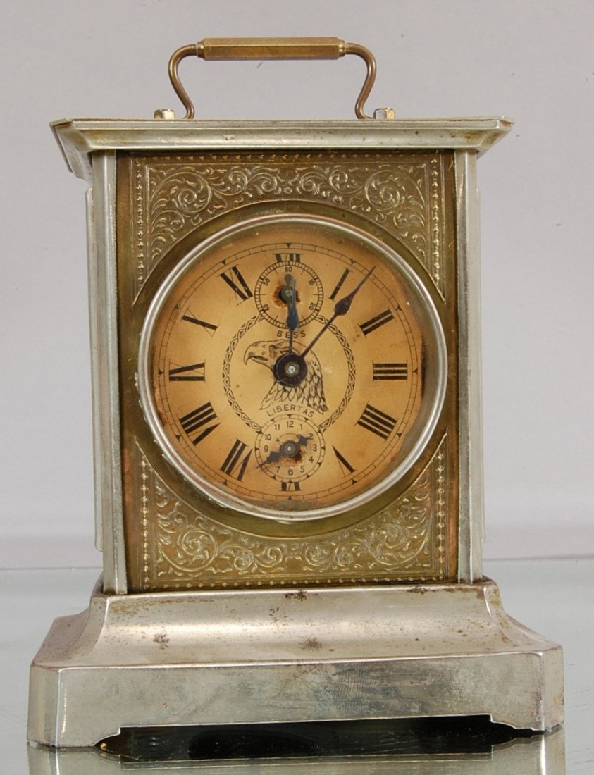 German Alarm Clock: With music box in base. Brass Decoration. 7" t x 5" w Ca. 1900