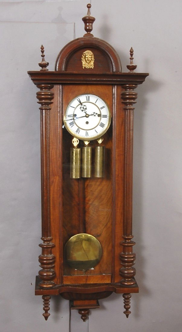Gustav Becker 3 Weight Vienna Regulator Clock: In Walnut case, 8 day movement, Porcelain dial, Grand Sonnerie movement. 48" t x 15" w. Ca. 1880