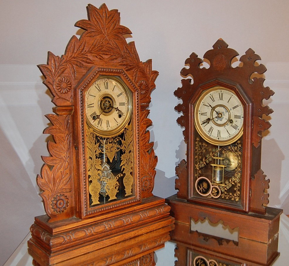 2 Wood Mantel clocks: Walnut New Haven 19" t; Oak Gilbert with alarm, 24" t. Ca. 1900