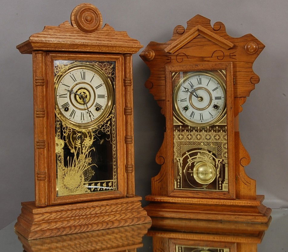 2 Oak Mantel Clocks: Welch with partial label. 21" t with alarm. Ca. 1900