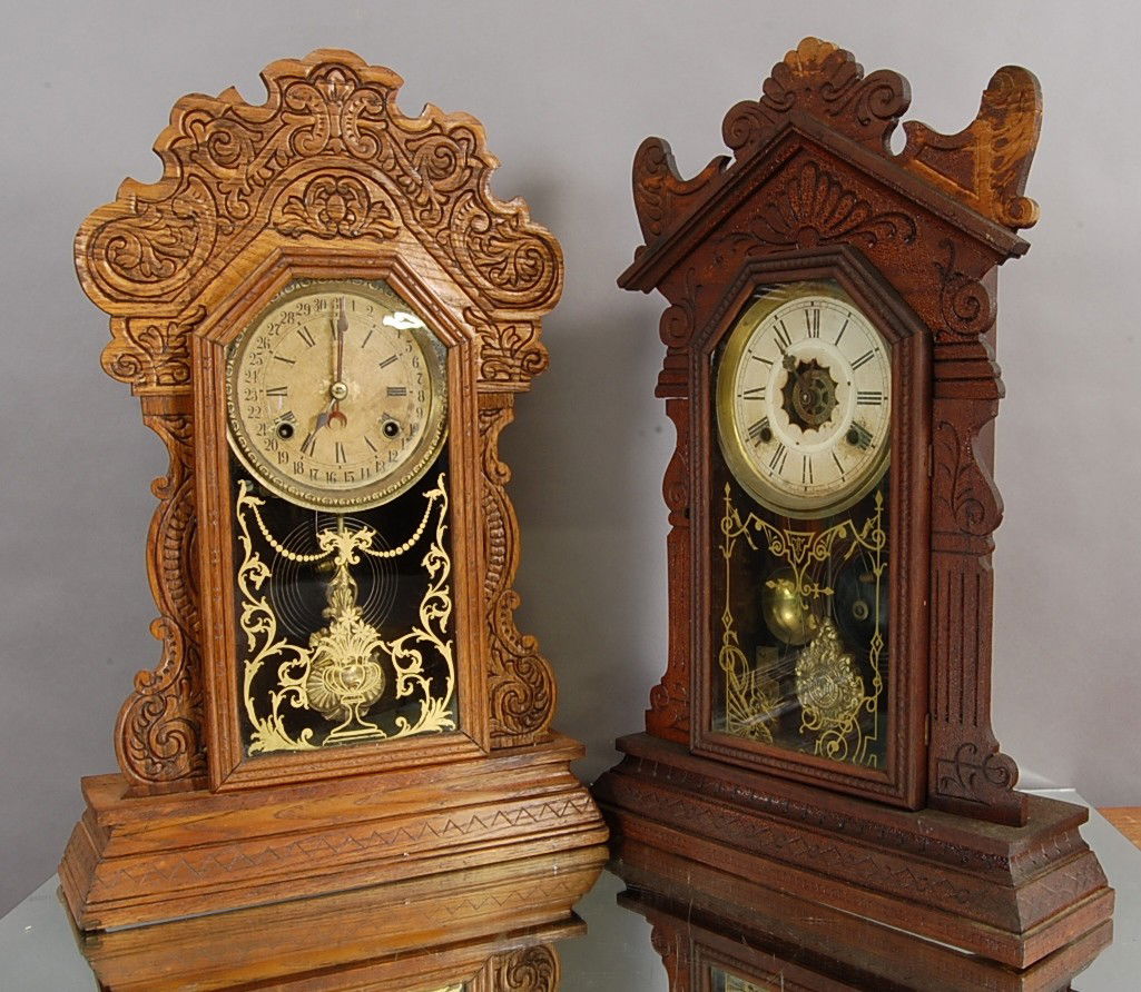2 Waterbury Oak Mantel Clocks: Time & Strike. 22" t 23" t. Ca. 1900
