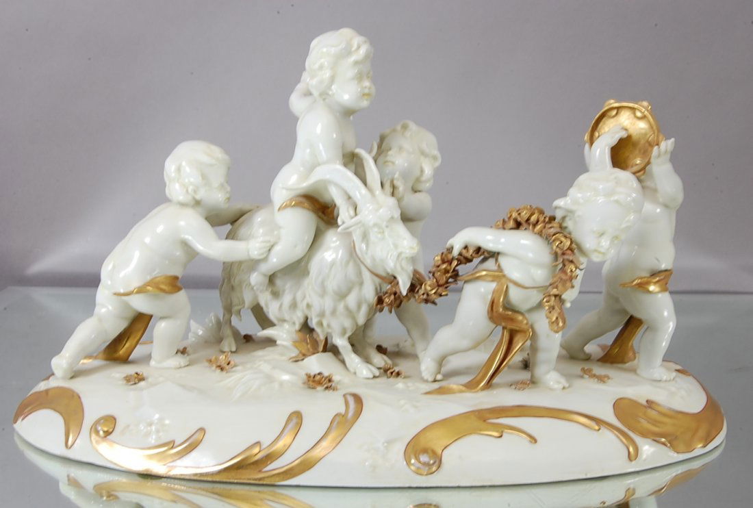 Capodimonte style Porcelain Center Piece: Applied Gilting, Cherub & Goats playing. 16" w x 9" t. Ca. 1910