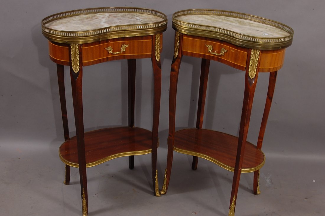 Pair of French Louis XV style marble top side table: Brass gallery surrounding top, 1 drawer. 28" t x 17" w. Ca. 1920