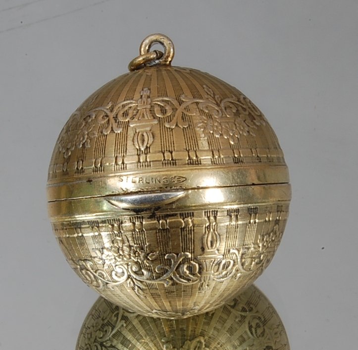 Sterling Silver Locket: Excellent detail. .4 troy oz. Marked sterling. Ca. 1960 1" d.