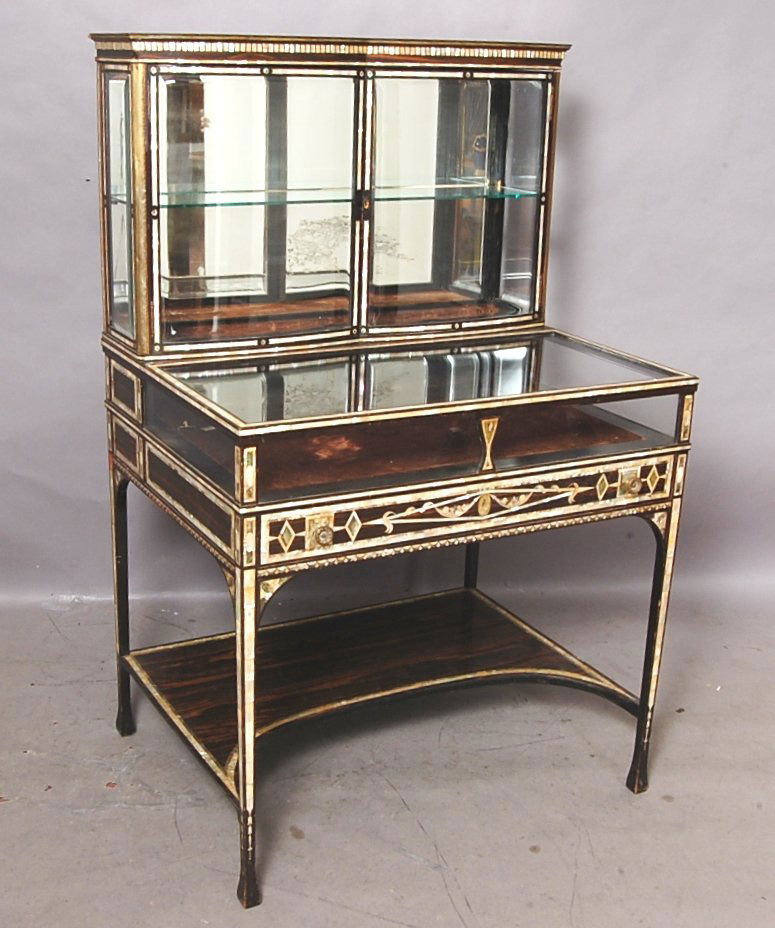 French 19th Century Ladies Dressing Table: Mother of Pearl & Abalone inlaid on rosewood. Curved beveled glass doors in top. 3 Locking compartments. 53" t x 26" d x 34" w. Ca. 1890