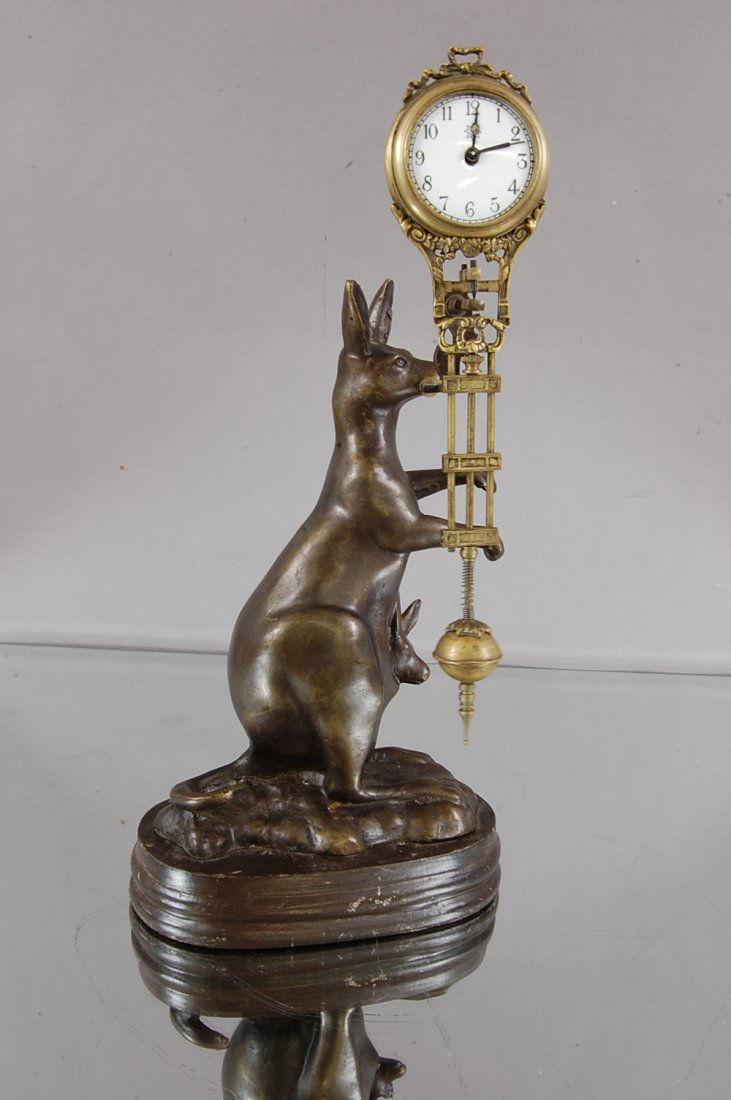 Junghans Mystery Swinging Ball Clock: Jewel mounted on bronze Kangaroo statue. Porcelain Dial, Time only 13" t. Ca. 1900