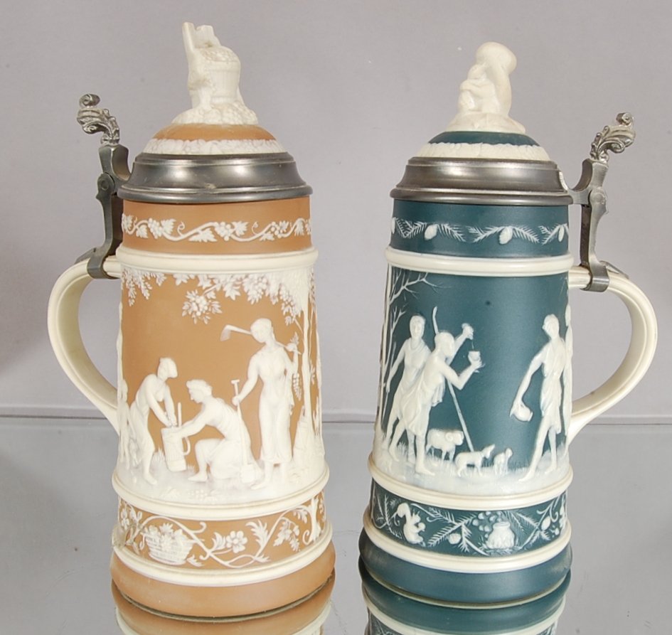 2 Mettlach Steins: Herbest 11"t, Winter 11" t Villeroy & Boch Signed on bottom.