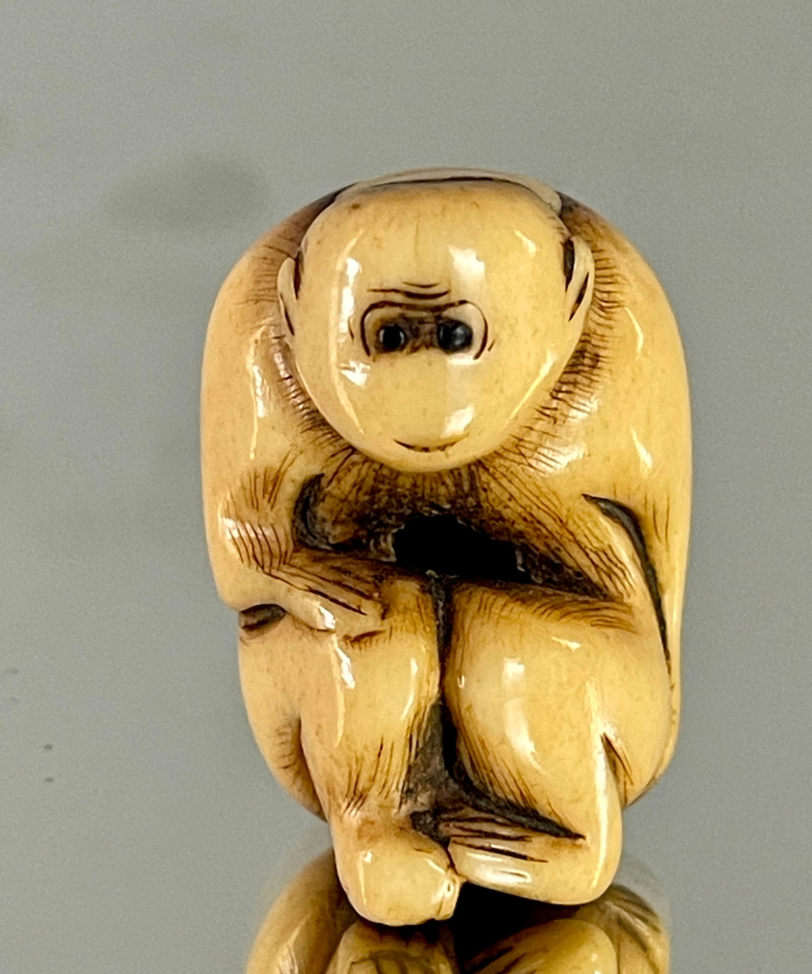 A Charming Stag Antler Netsuke of a Seated Monkey (1 of 5)