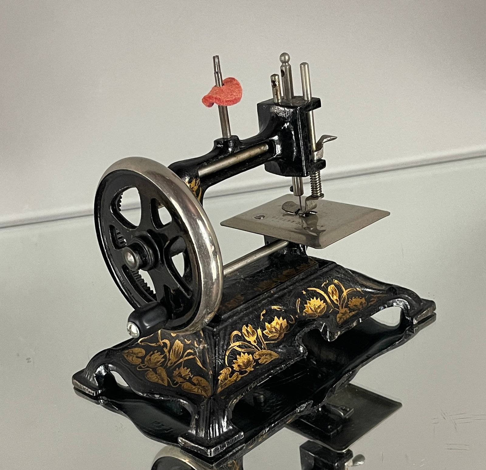Antique German Mullen 12 Hand Crank Cast Iron Childs Sewing Maching: Miniature. Hand crank. Germany. Ca. 1880. Size: 7"t x 5"d x 8"w.