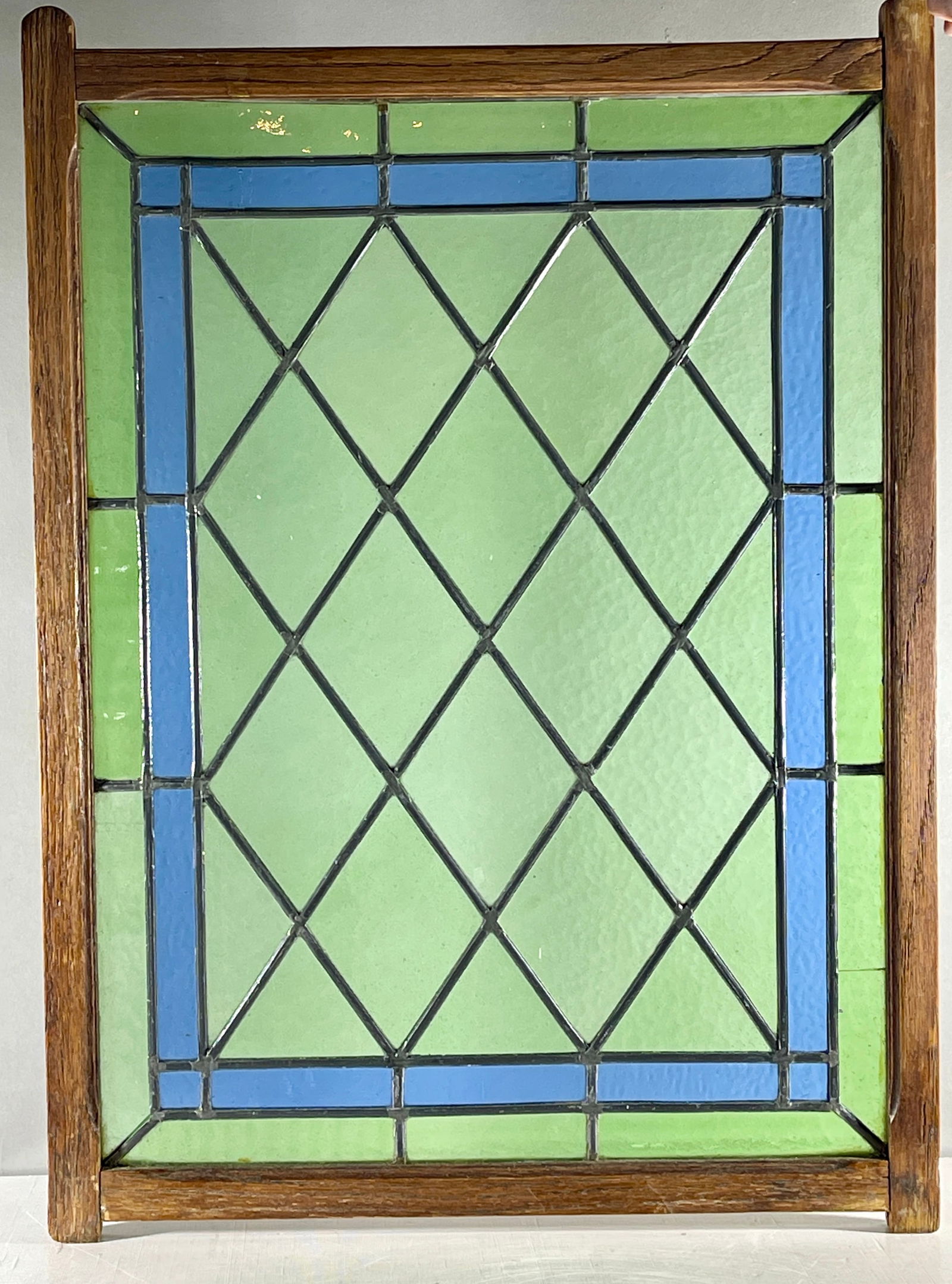 French Arts & Crafts Style Stain Glass Window: Leaded in oak frame, 18" x 25", circa 1910.