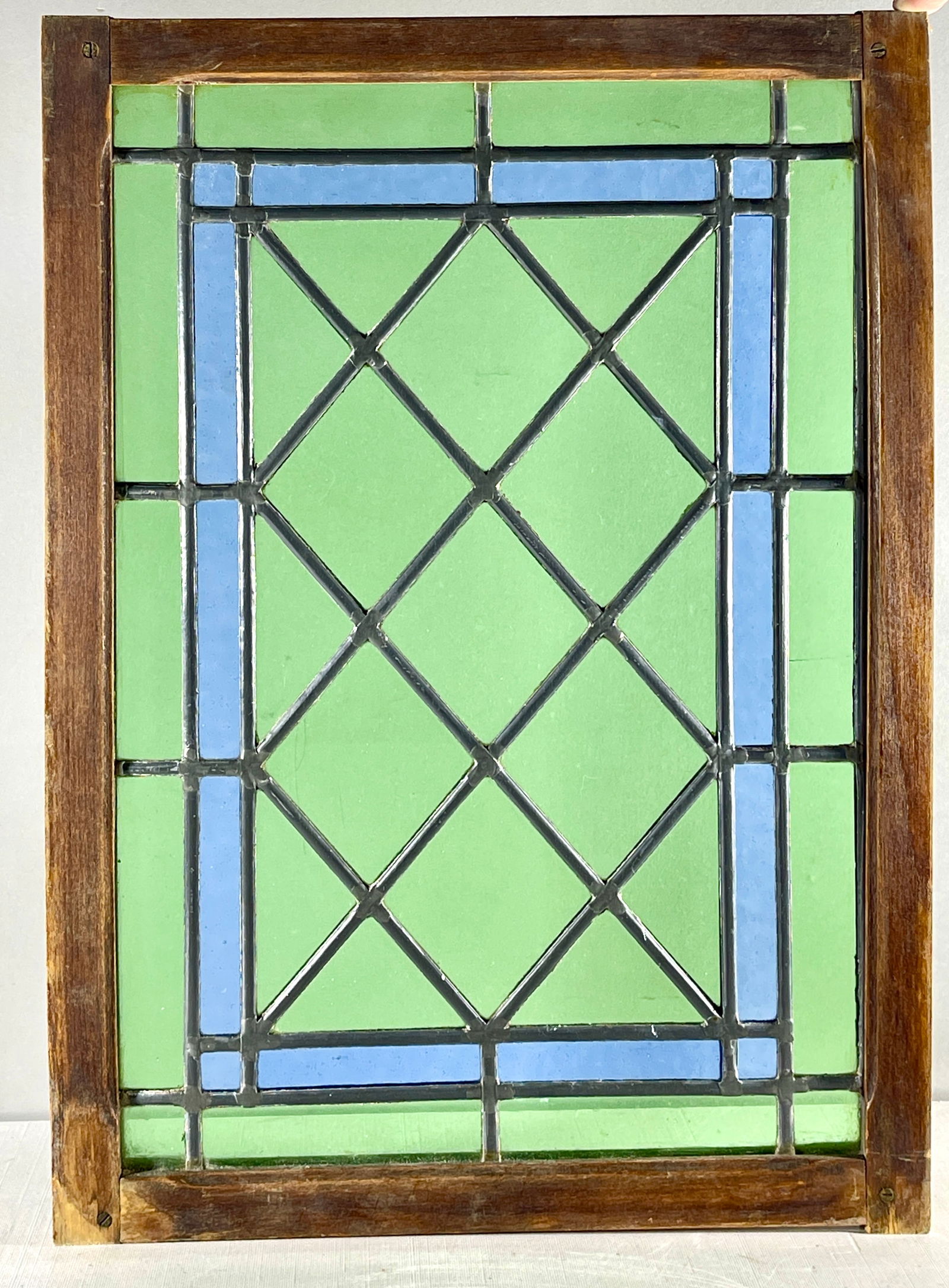 French Arts & Crafts Style Stain Glass Window: Leaded in oak frame, 19 1/2" x 13 3/4", circa 1910.