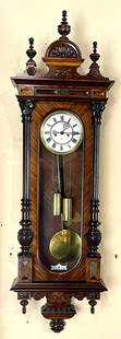 Gustav Becker Vienna Regulator: Walnut case, carved crest, 1/2 columns on side, 2 weight movement, porcelain dial, signed G.B., excellent condition, complete and running order, 54"t x 7 1/2"d x 16 1/2"w, circa 1900.