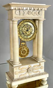 French 19th Century Portico Mantel Clock: White marble portico mantel clock, fancy bronze dial with embossed ship, anchor and pegasus in the background, with matching pendelum, 19"t x 6"d x 10"w, circa 1880, France.
