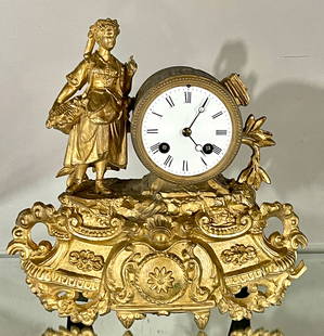 Japy Freres French Gilted Figural Mantel Clock: Spelter figure of a lady gathering flowers, porcelain dial, time & strike, complete running order, some losses, 11"t x 4"d x 11"w, Paris, circa 1890.