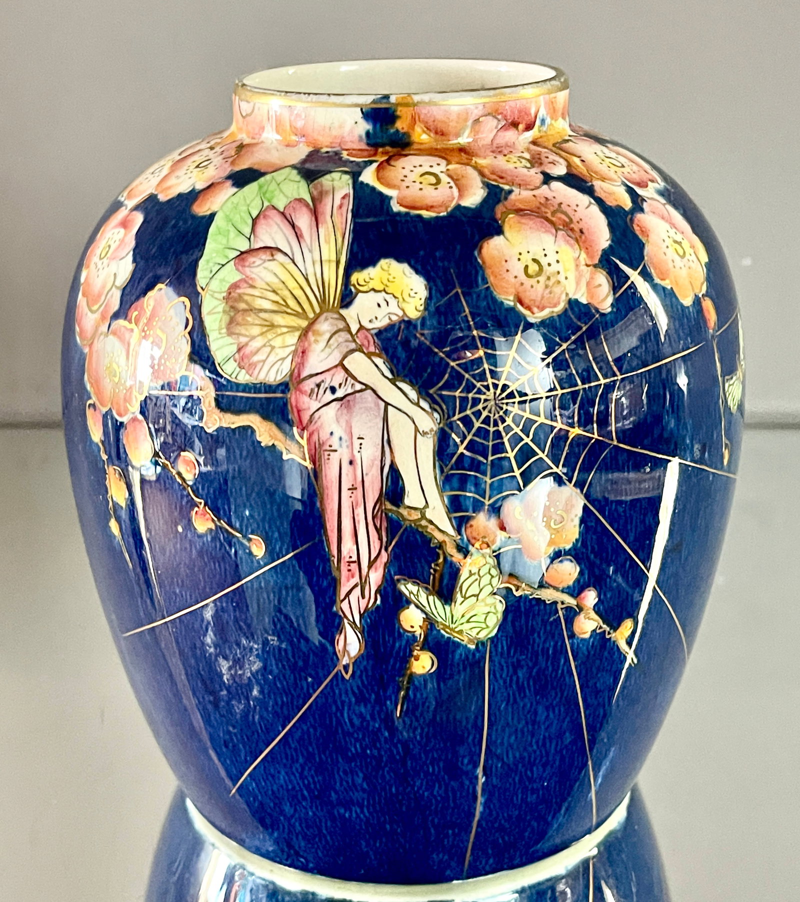 Rare Grimwades Royal Wenton Bouquet Vase: "Fairy Cobwebs", a yellow haired fairy sits in the branch of a flowering cherry tree, gold outlining, deep blue background, #2751, Royal Wenton mark, 7"t x 6"w,