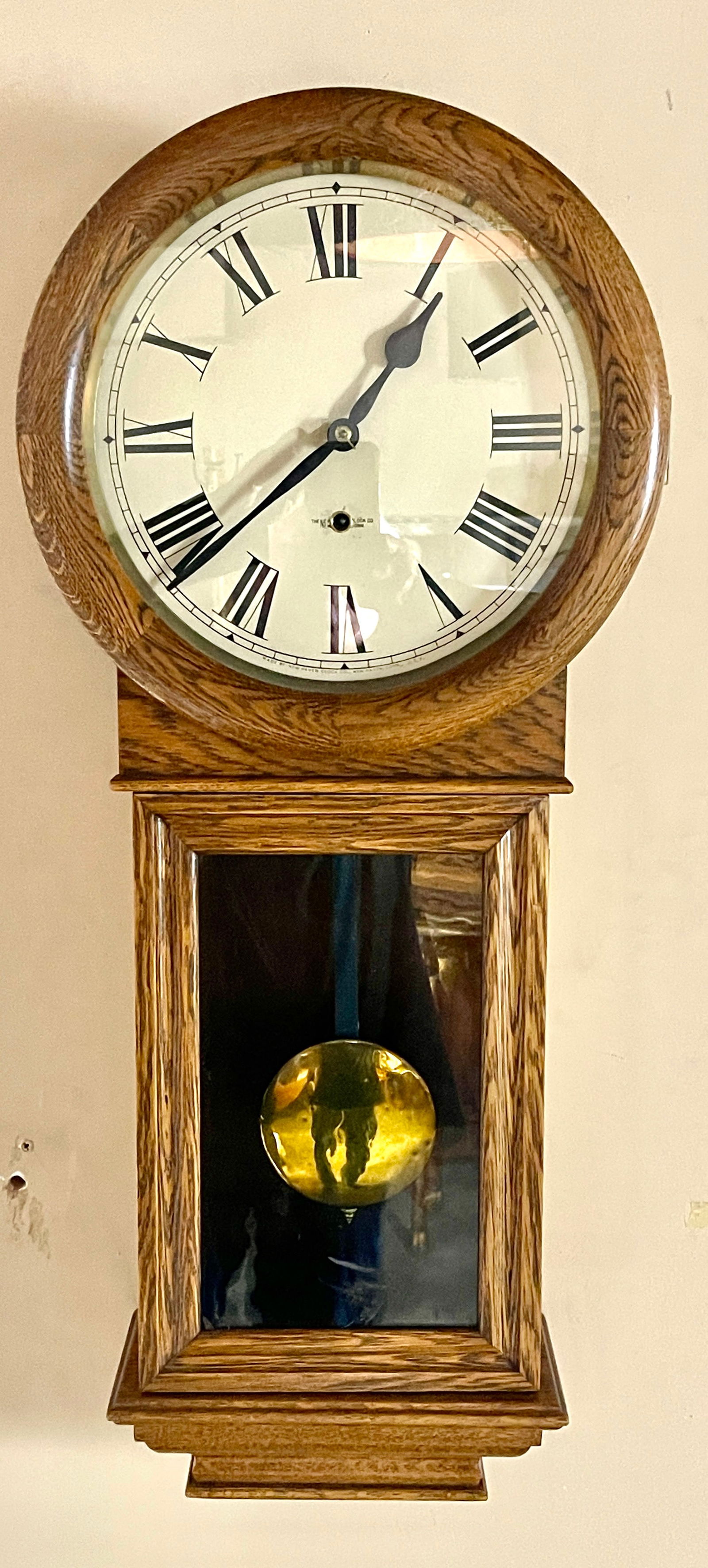 New Haven Oak Regulator Wall Clock: Eight day movement, time only, 11"dial, clock is complete, USA, 35"t x 7"d x 15"w, circa 1900.