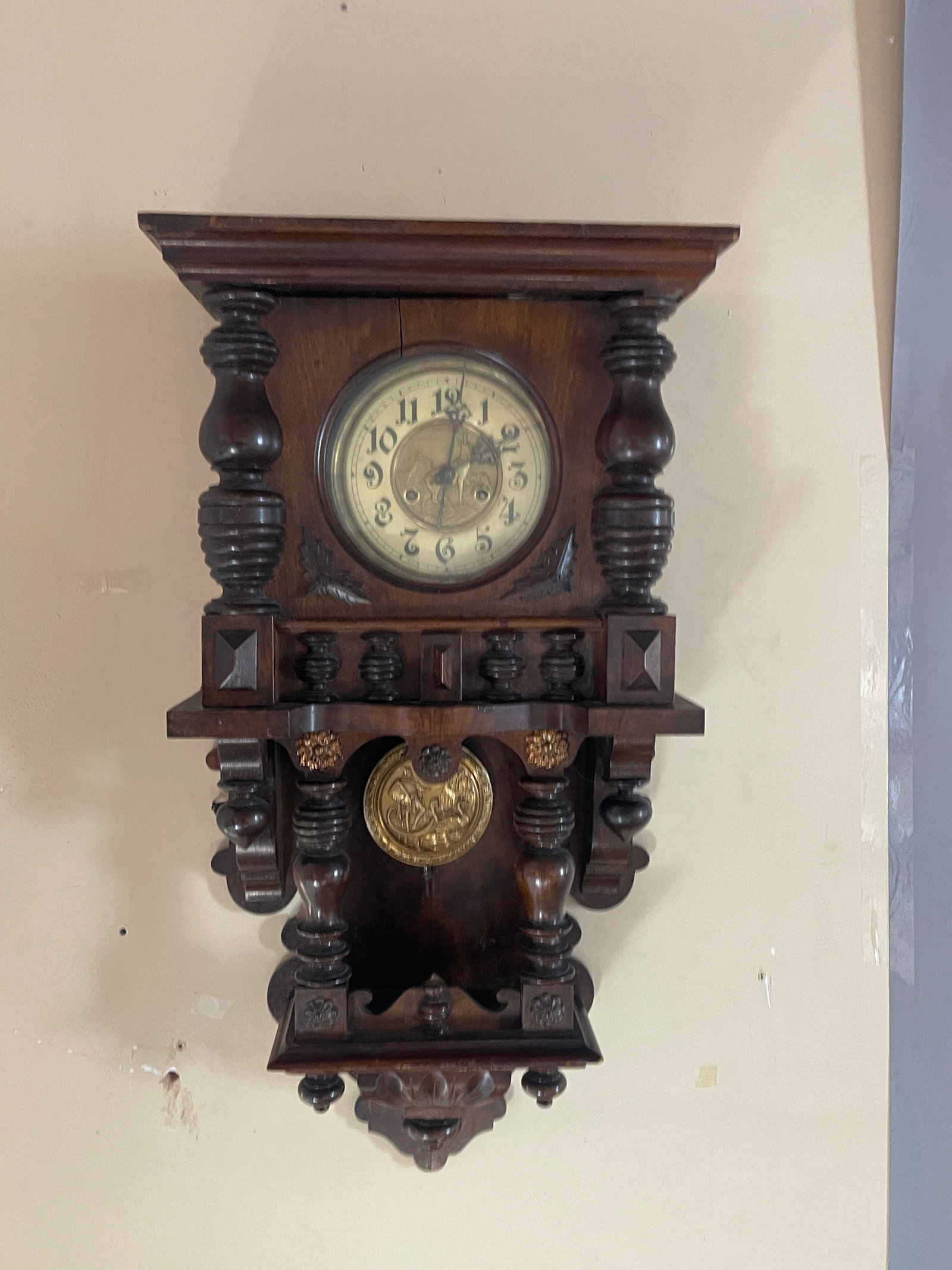 German Walnut Free Swinger Wall Clock: With unusual German goat embossed in middle of brass dial, Roman soldier with goose embossed in pendelum, complete and running order, 32"t x 8"d x 16"w, Germany, circa 1900.