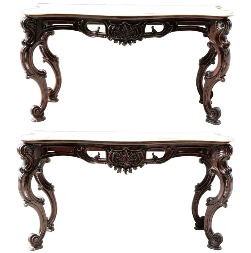 Rare Large Pair Anglo Indian Raj Palace Marble, Mahogany Console Tables: Large Pair of Anglo Indian Rococo Style Marble Top Mahogany Console Tables. This large pair of antique Anglo Indian consoles were hand fashioned in the Rococo Revival style. They feature robustly desi