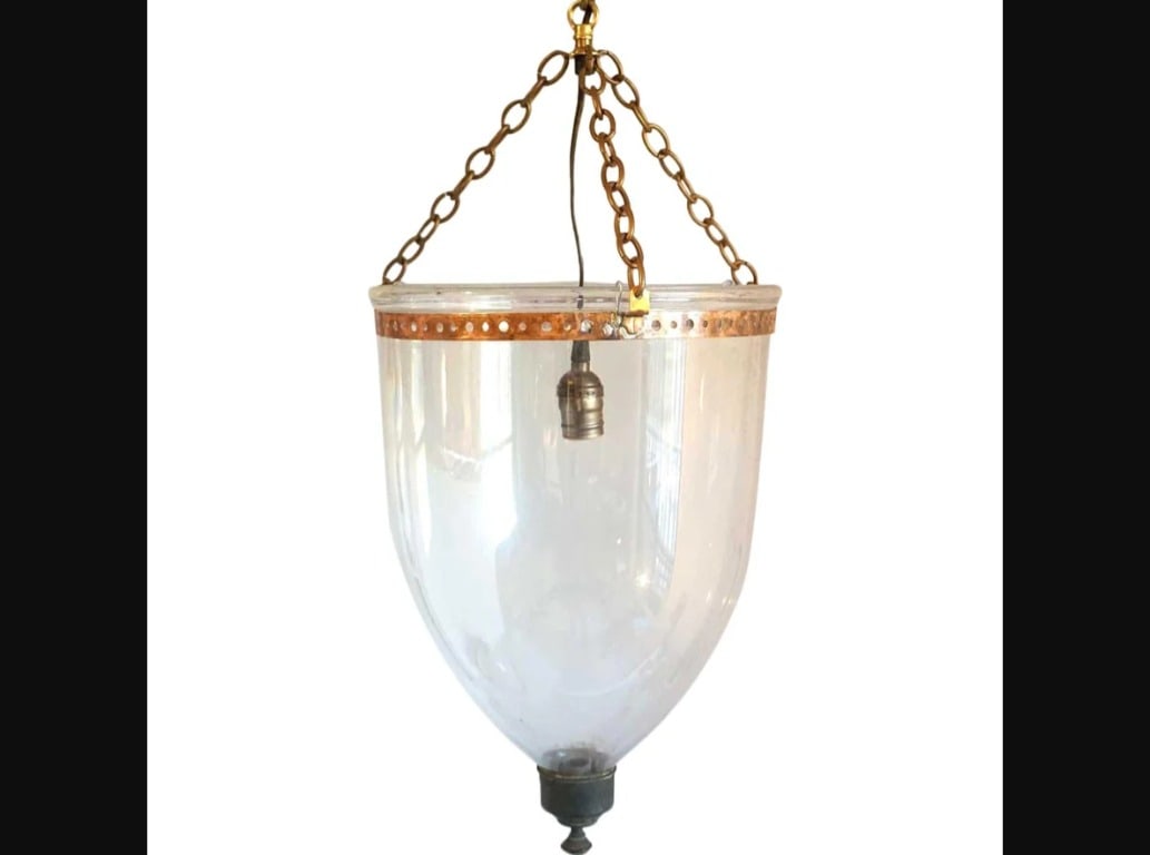 English Regency Style Glass One-Light Pendant Hall Lantern: This antique 19th century English pendant hall light features a clear blown glass bell with brass terminal, all suspended by a metal collar, and chains. Originally used for candles, this fixture has b