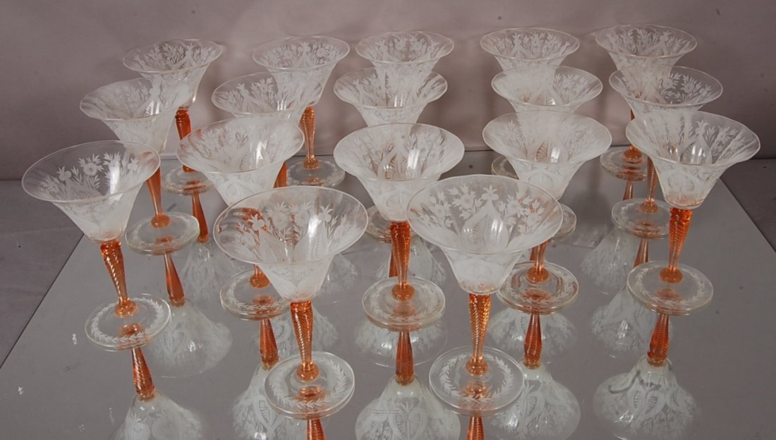 Steuben Wine Glasses: Set of 16. Twisted stem, with Leaf & Floral cut design. Signed on base. 6 1/2" t, 4 1/2" d. Ca. 1920