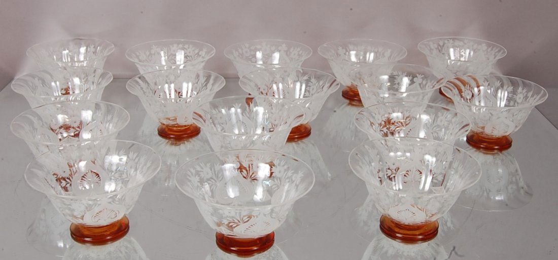 Steuben Fruit Bowls: Set of 16. Leaf & flower cut design. Art glass base. 2 1/2" t x 5" d. Signed Steuben. Ca. 1920. From the Estate of Sallie P. Kimbrough.