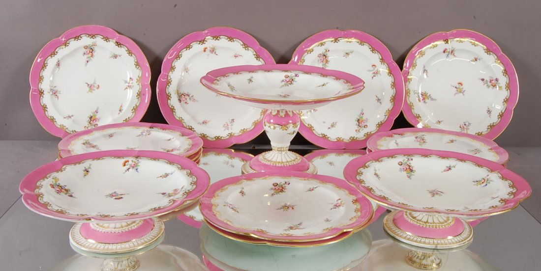 14 pc. Limoges style Dessert Set: Hand decorated floral decoration with gold trim. 1 Center bowl, 2 stands 9 1/2" d x 3" t. 11 plates. V Marked on bottom. Ca. 1900. From the estate of Sallie P. Kimborough.