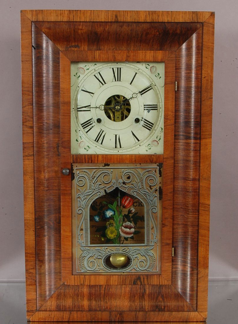 Early Seth Thomas shelf clock: Rosewood case. 2 weight movement, floral decorated door. Time & strike. 26"t x 16" w. Ca. 1850 Made in Plymouth Hollow, Conn.