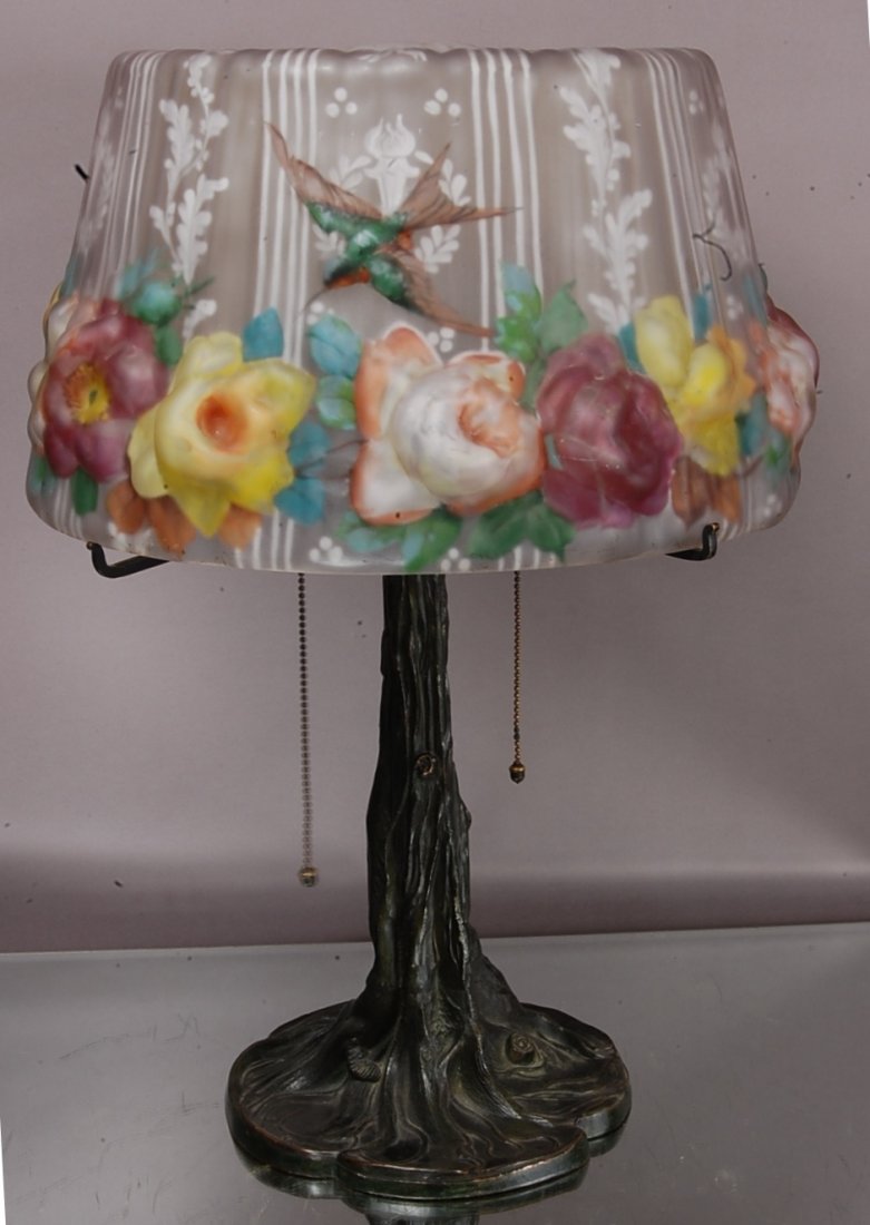 Pairpoint Puffy Bird of Paradise Parlor Lamp: Reverse painted stain glass shade repaired. Base is signed with paper label. 23" t x 16" w. Ca. 1915