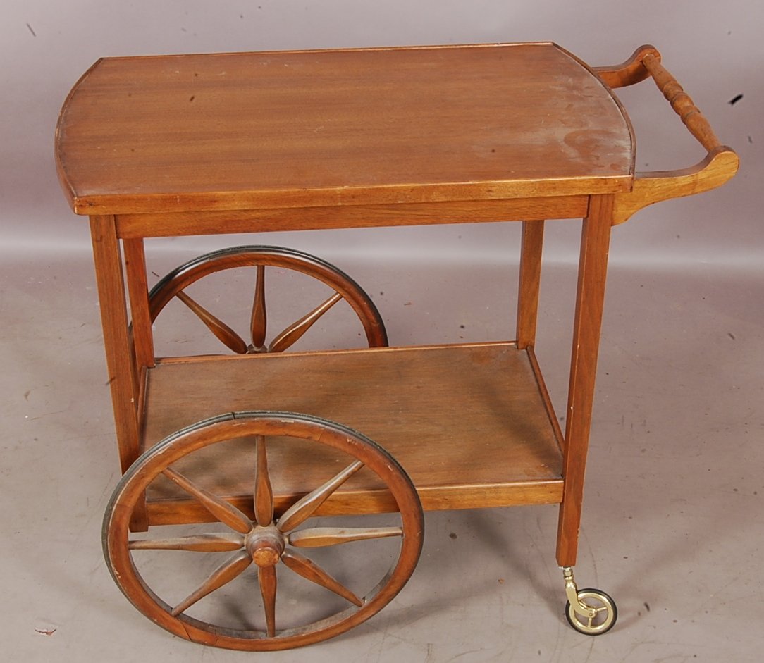 1920's mahogany Tea Cart: With wood wheels. 28" t x 31" l x 18" w. Ca. 1920