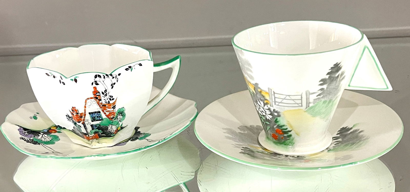 Two Shelley Queen Anne Tea Cups and Saucers: MARKS: signed Shelley DIMENSIONS: 3 1/4"t x 5 1/2", 2 1/2"t x 5 1/4" ORIGIN: England CIRCA: 1910.