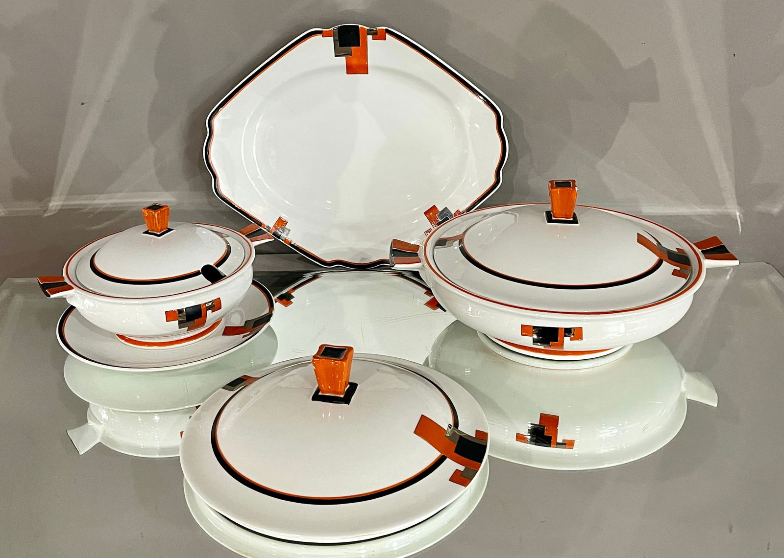 Art Deco Shelley Vogue 4 Piece Serving Set: DIMENSIONS: 9 1/2" x 11 1/2" plate, 5 1/2" x 9 1/2" x 11 1/2" w Tureen, 4"t x 6"d x 7 1/2"w covered bowl, 7"d small plate, 8 1/2"w top. ORIGIN: England CIRCA: 1920.