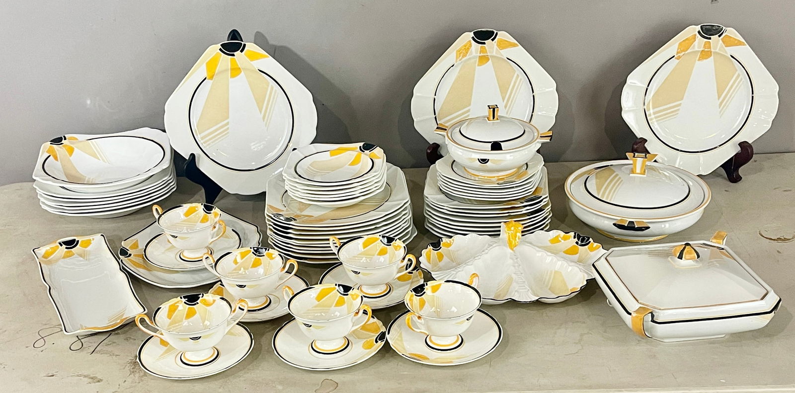 Shelley Sunray Pattern Vogue Parial Dinner Set: 53 pieces including serving pieces MARKS: marked on bottom, No 11742 ORIGIN: England CIRCA: 1930.