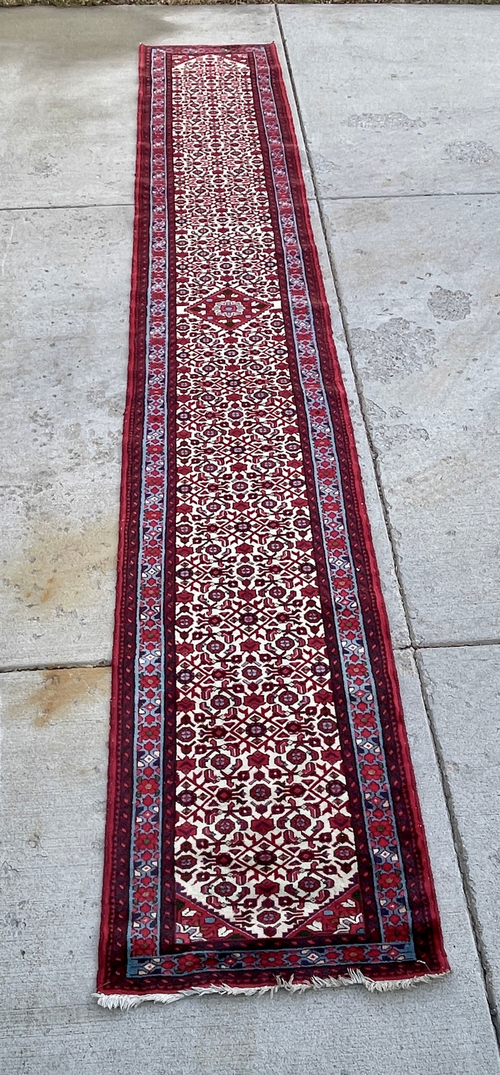 Vintage Persian Bidjar Runner: Hand knotted, wool. DIMENSIONS: 16'8" x 2'6" ORIGIN: Iran CIRCA: 1950.