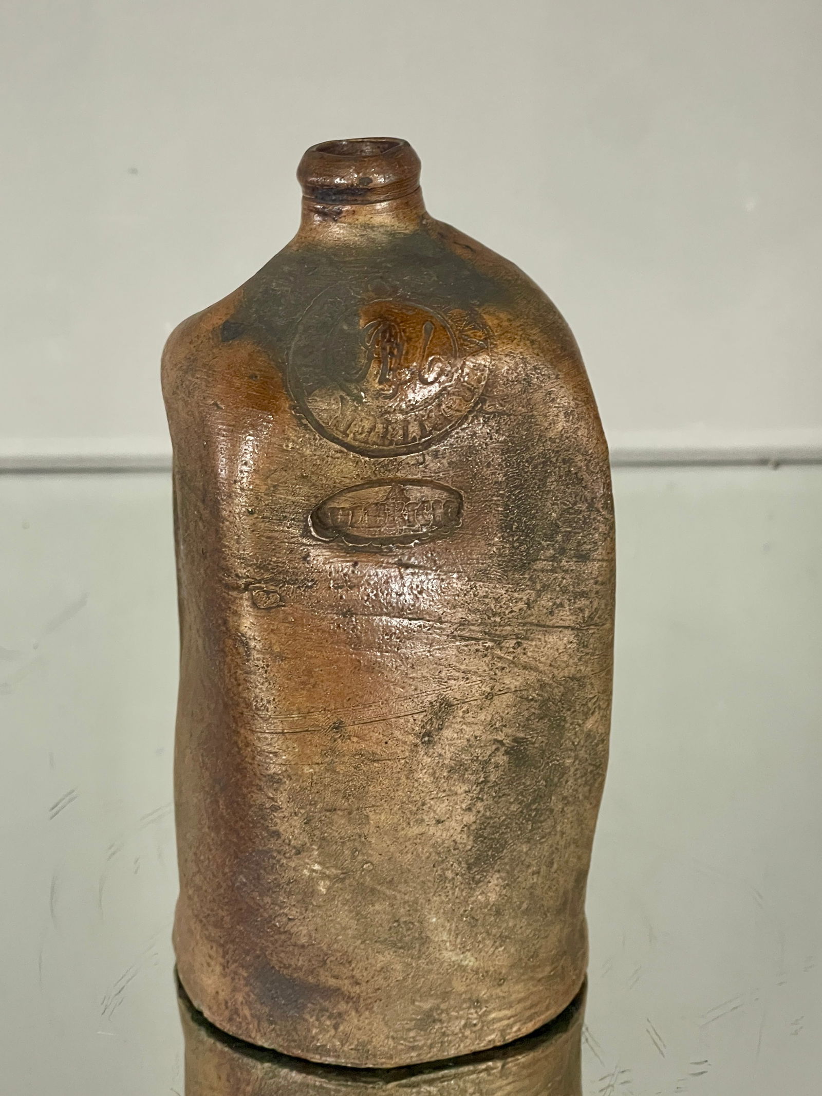 Early Brown Glazed Jug: With writing on the side. DIMENISONS: 7 1/2"t x 3 1/2"w ORIGIN: France CIRCA: 1880.