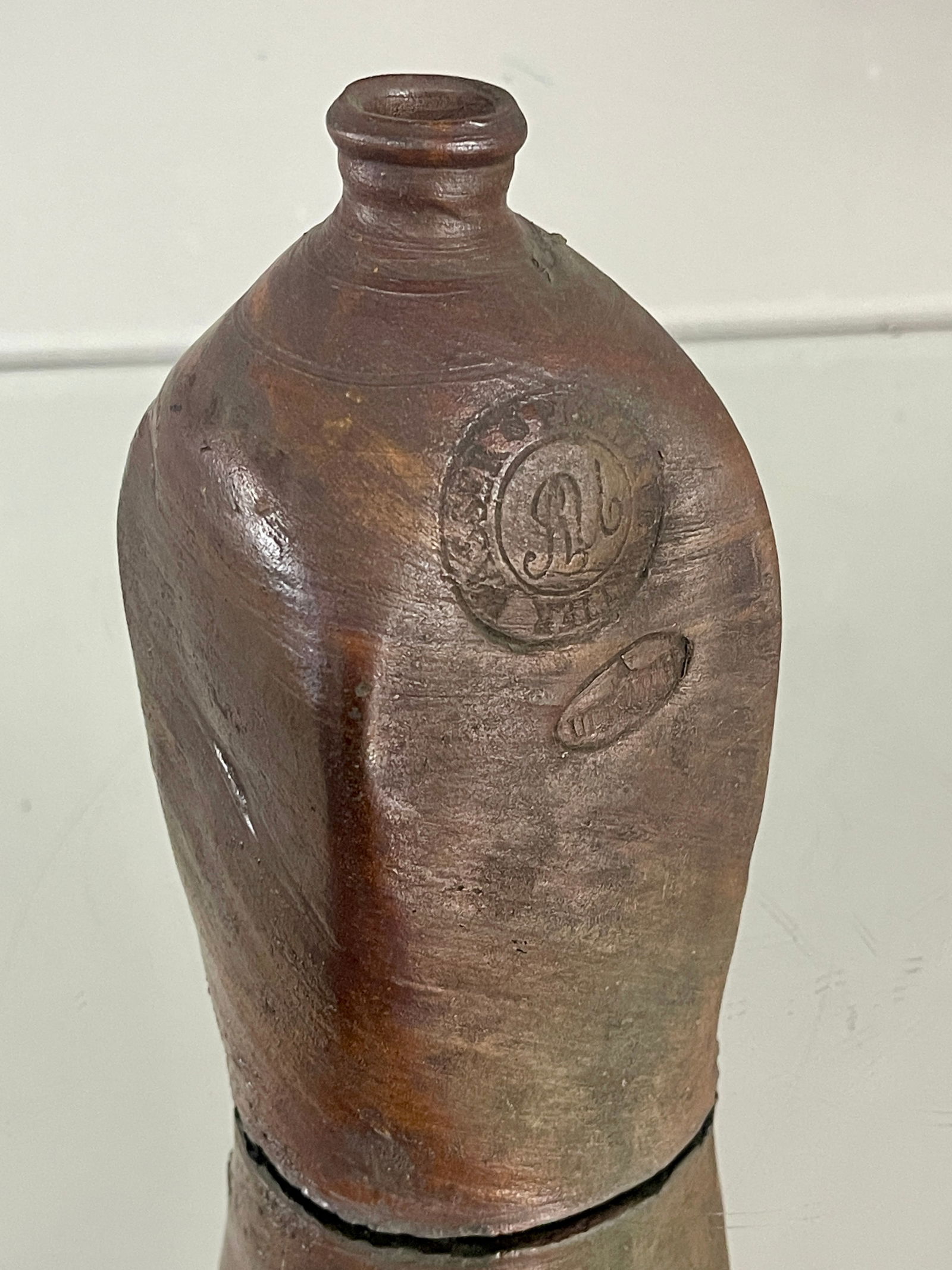 Early Brown Glaze Jug: With writing. DIMENSIONS: 7 1/2"t x 3 1/2"w ORIGIN: France CIRCA: 1880.
