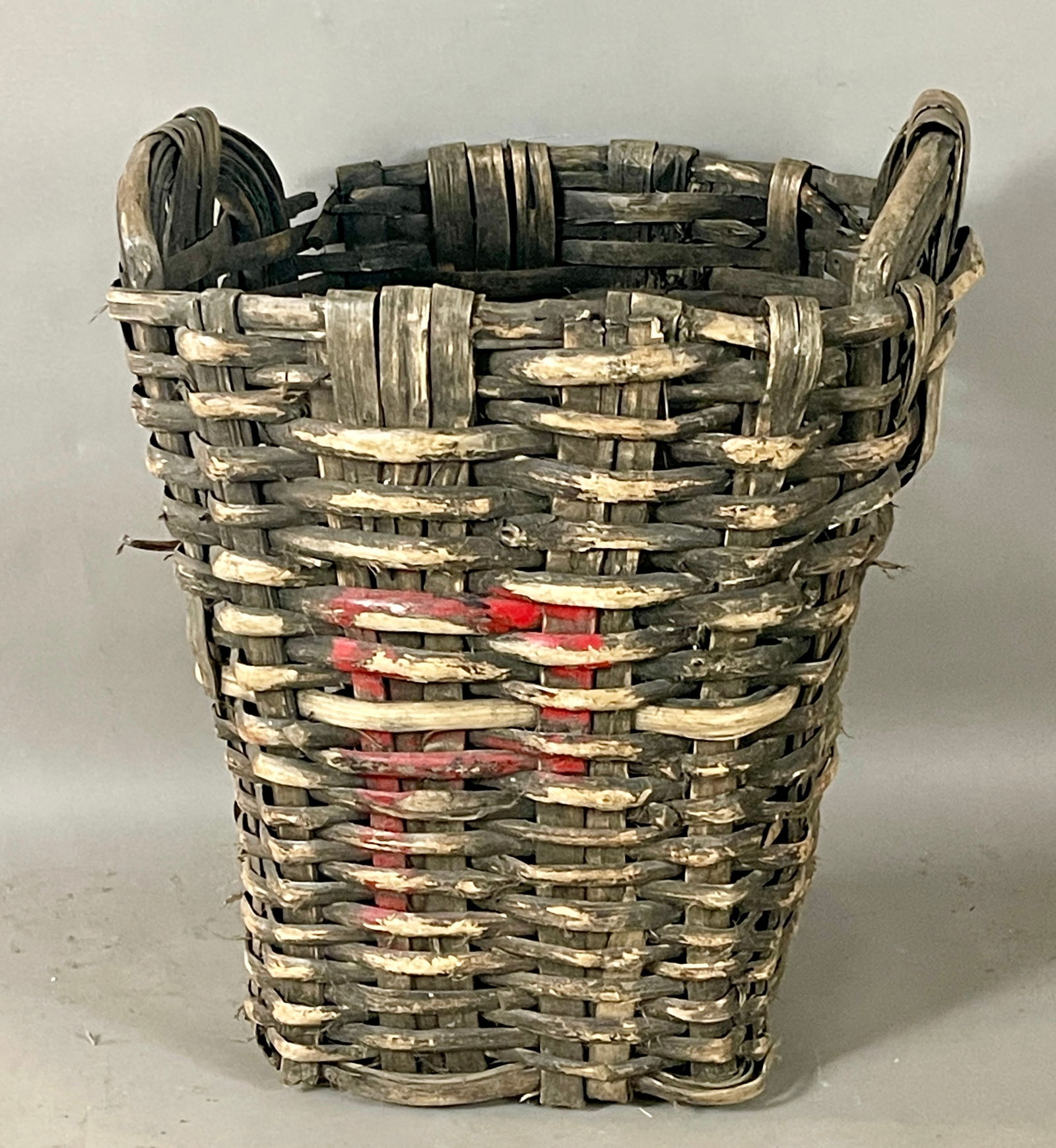 French Vintage Grape Harvest Basket: Woven cleft oak with a handle on each side. DIMENSIONS: 27"t x 20"d x 22"w. ORIGIN: Burgandy, France CIRCA: 1920.