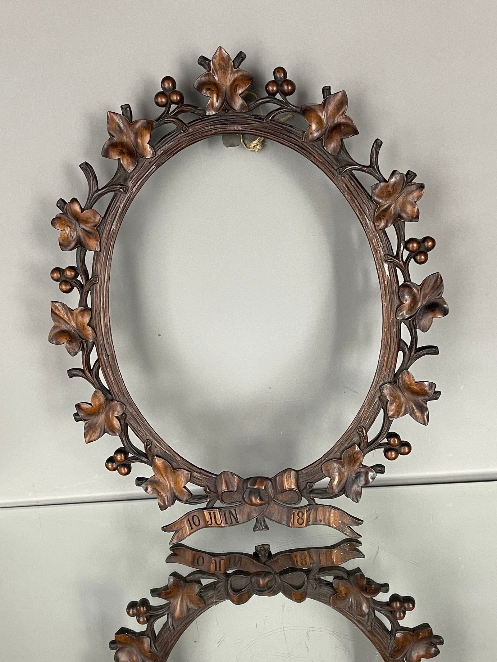 Black Forest Carved Oval Frame: Fruit and leaf carved. DIMENSIONS: 19 1/2"t x 15 1/2"w ORIGIN: Germany CIRCA: 1870.