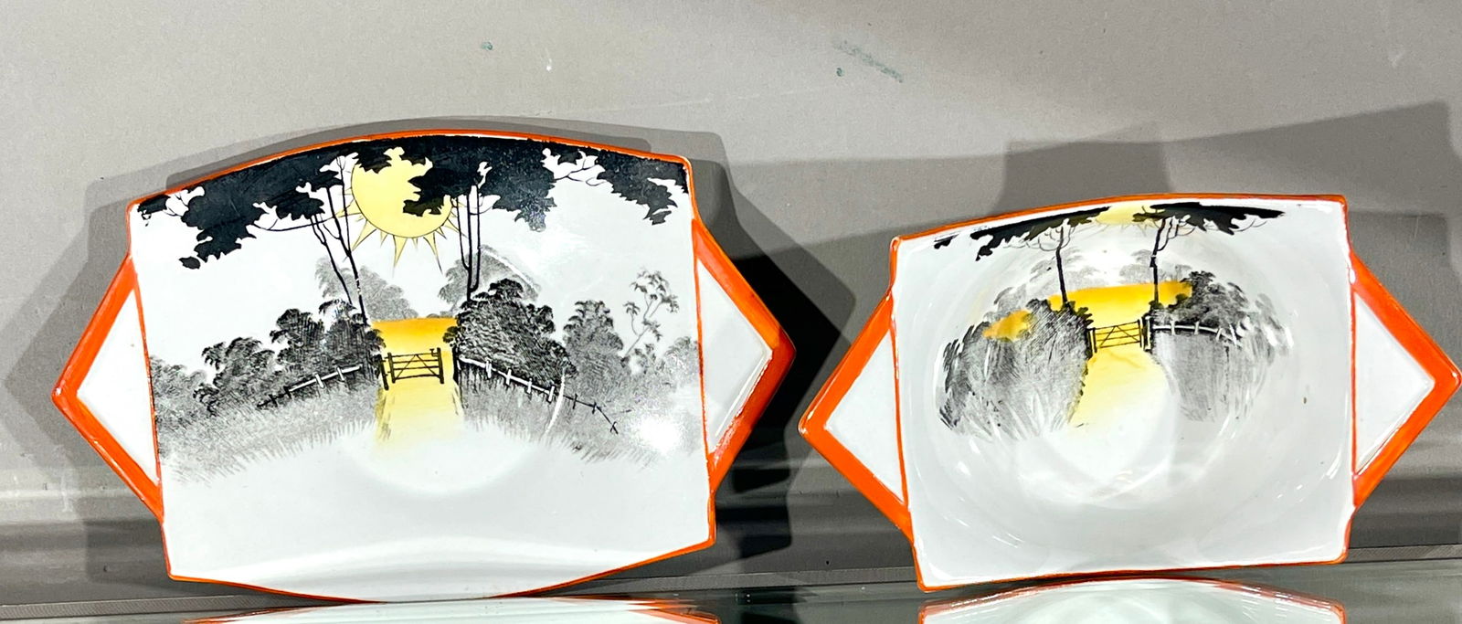 Shelley Art Deco Two Piece Bowl and Plate: Sunrise and tall trees. MARKS: signed on bottom #951 & 952. DIMENSIONS: plate 7" x 4 1/2" bowl 5 1/2" x 3 1/2" CIRCA: 1920.