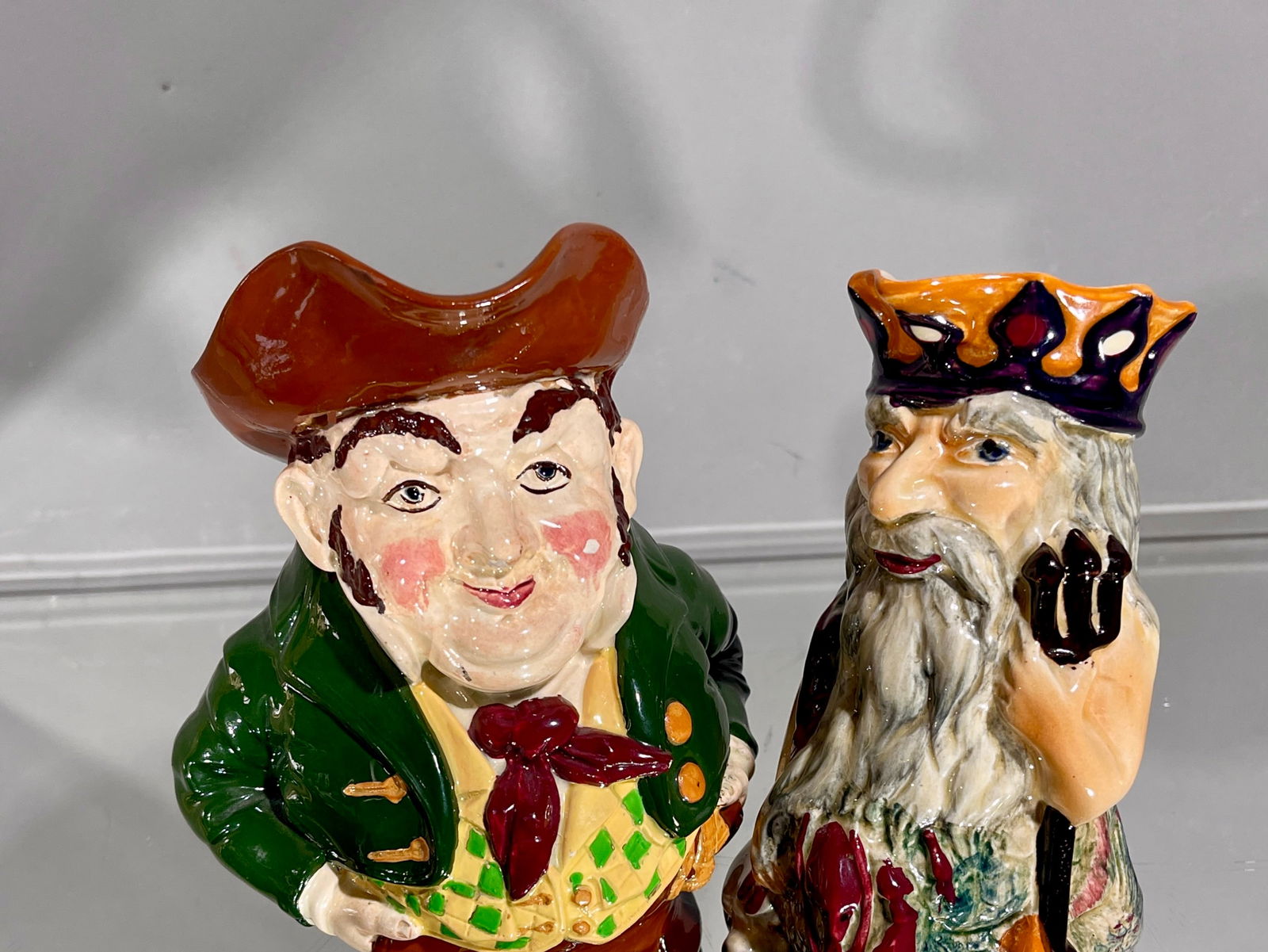 2 Jugs Foley Intarsio: "John Bull", Father Neptune CONDITION: some losses DIMENSIONS: 7 1/2"t , 7"t ORIGIN: England CIRCA: 1930.