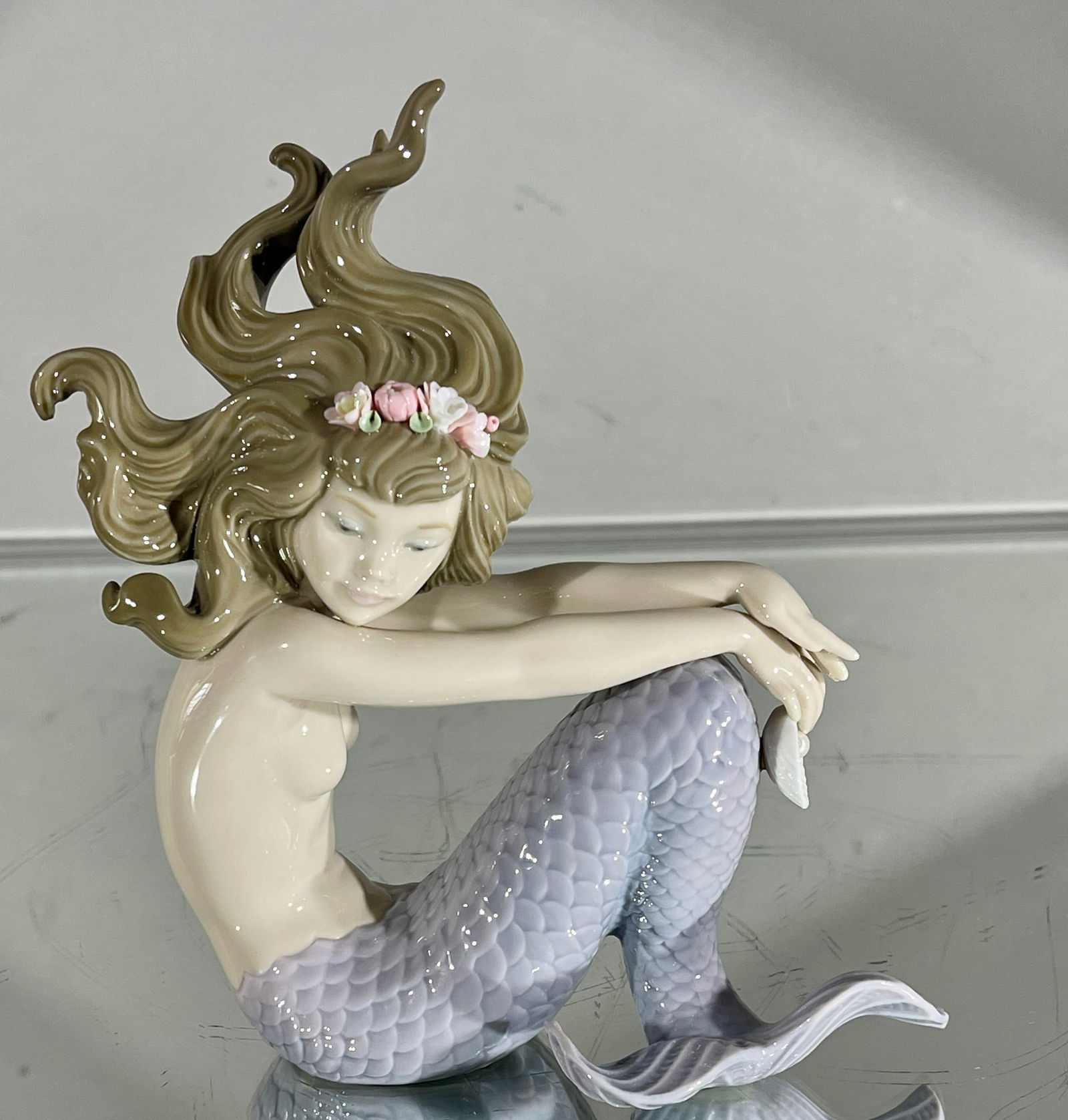 Lladro Illusion Mermaid Figure with Pearl: Porcelain figure # 1413. DIMENSIONS: 6"t x 5"w ORIGIN: Spain CIRCA: 20th century