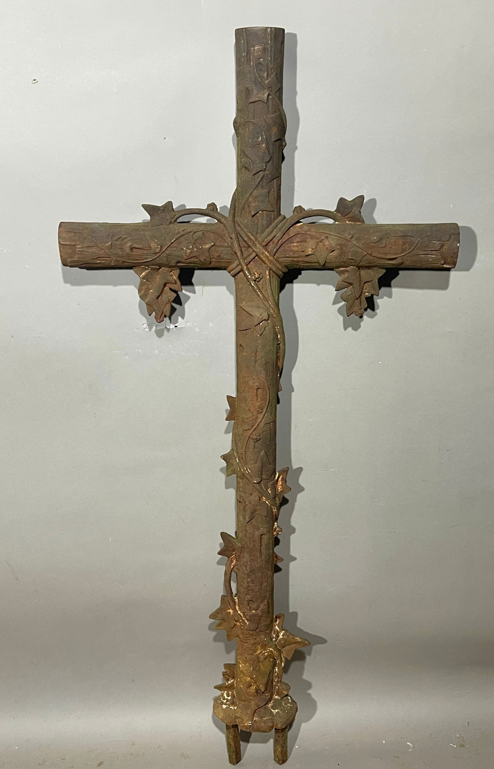 19th Century French Iron Crucifix: Designed with leaf & vines motiff. DIMENSIONS: 54"t x 25"w ORIGIN: France CIRCA: 1870.